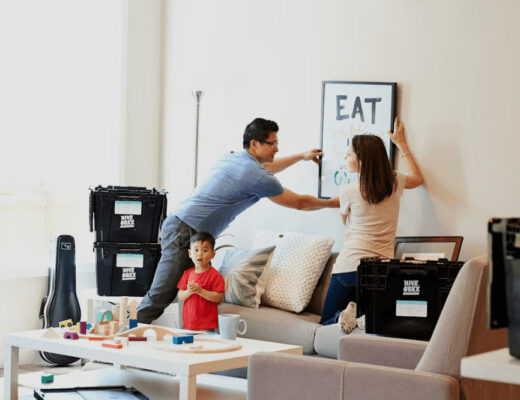 Renters painting a living room wall for