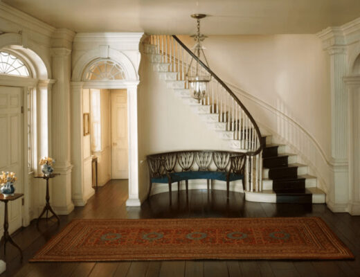 staircase with rug in a home, illustrating