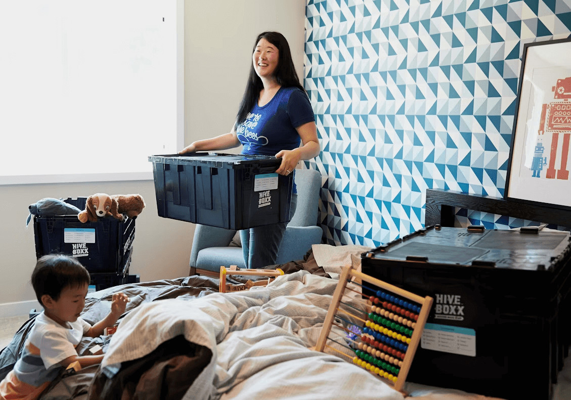 Woman and child on bed in a newly set up