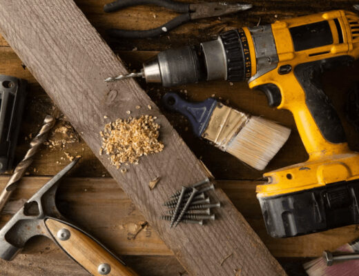 Wooden table with hammer and tools for