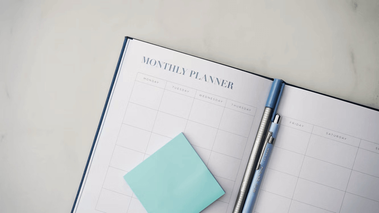 A planner with a pen for home improvement planning