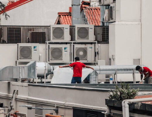Air duct cleaning technicians on a Maryland roof
