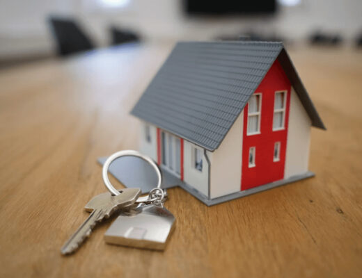 Keychain with a house key and a miniature