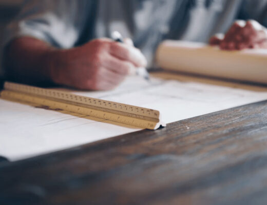 Man planning home improvements on paper