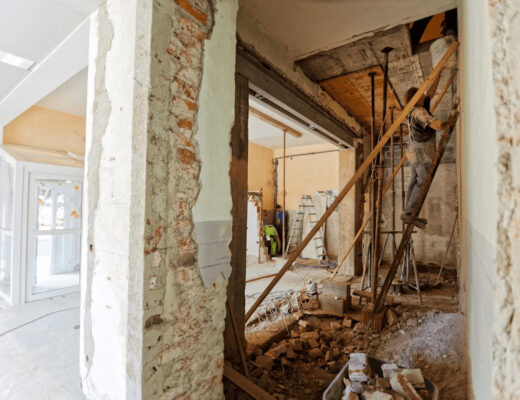 The Repairs Many Homeowners Never See Coming 1 Man standing in a home going through unexpected repairs