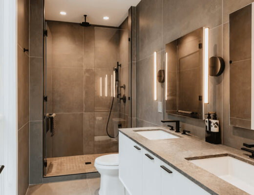 Modern bathroom with two sinks, toilet