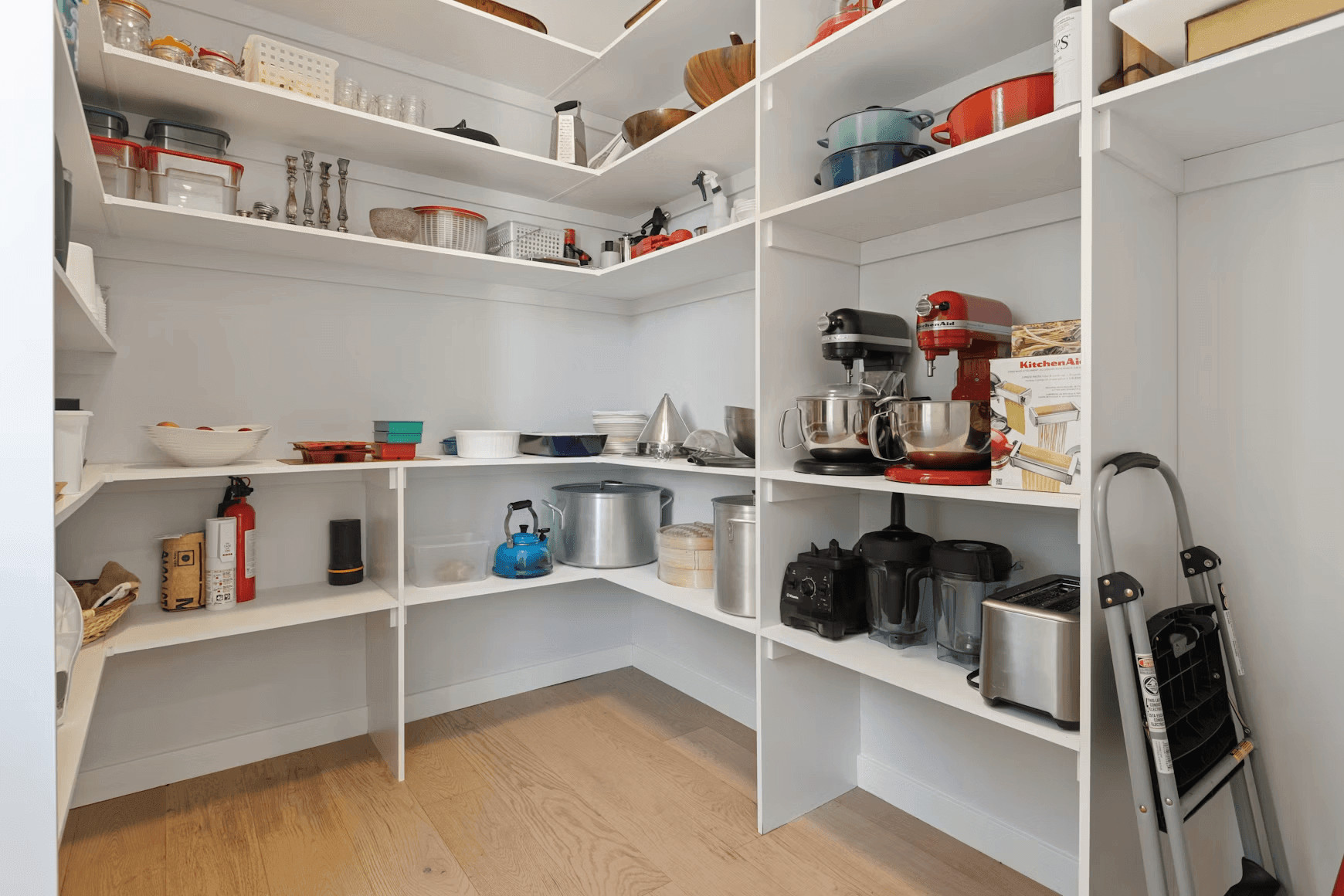 Modern kitchen with white shelving, wooden