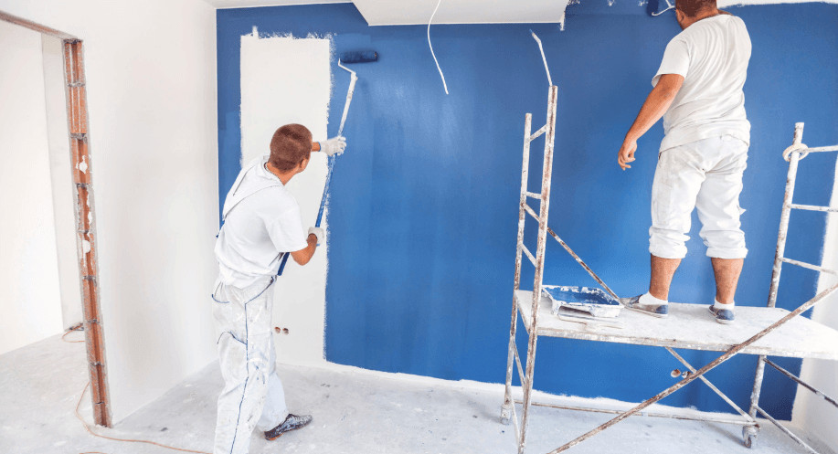 7 Best Painting Companies in Denver for Residential & Commercial Projects (2026) 1 painting the wall with blue