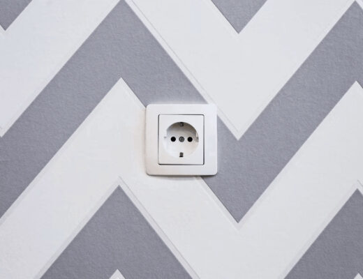 Warmth in Architecture: Reimagining Interior Decor With Electric Wall Panels 1 White light switch on modern wall