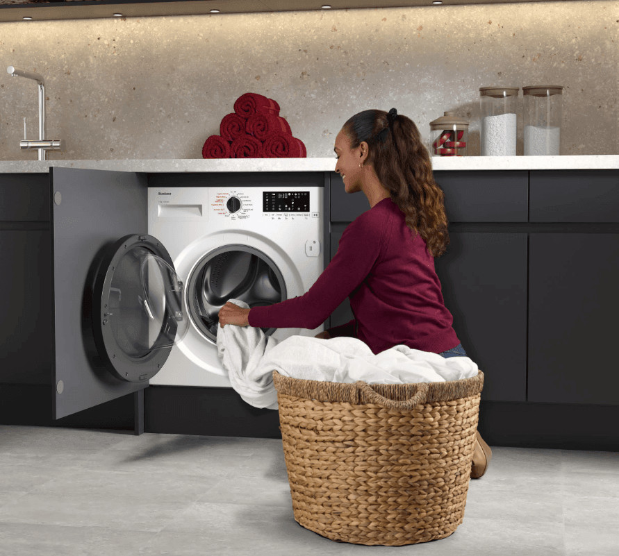 Blomberg Tumble Dryers: A Reliable Choice for Easier Laundry Days 2 A woman sitting on a laundry basket in front