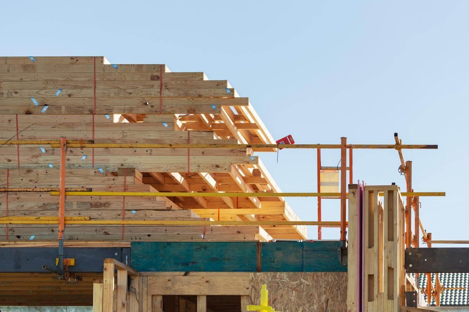 Building a Room Over a Garage: What to Plan Before You Build 3 Building under construction with scaffolding for a