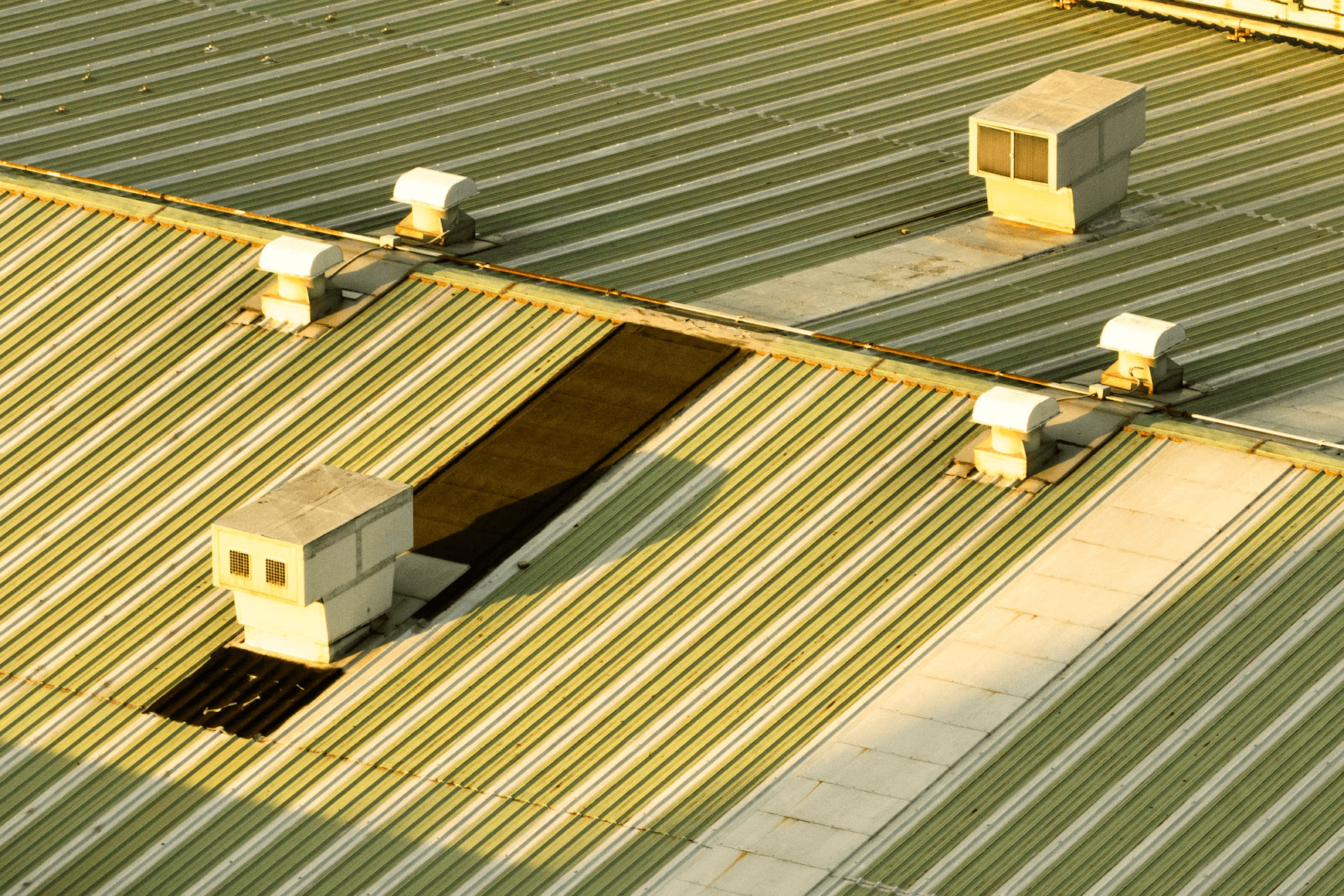 Commercial roofing with three air conditioners