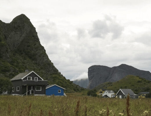House in a field with mountains