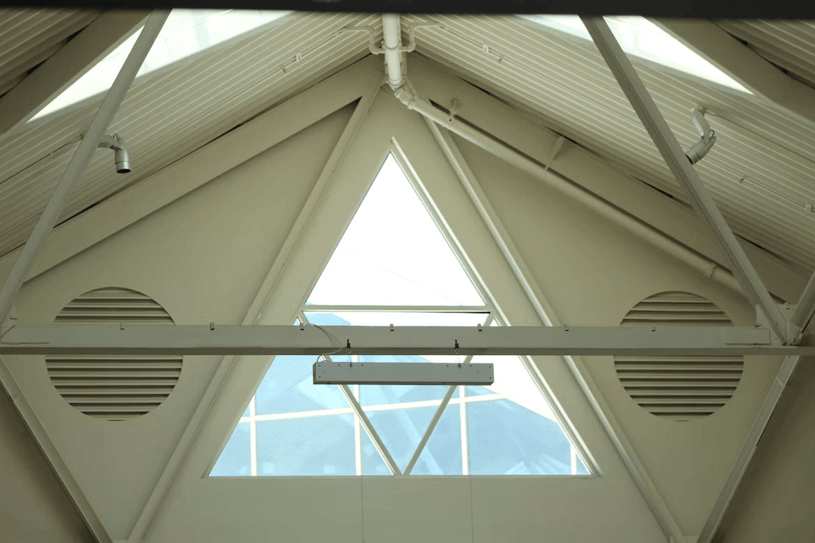 How does proper attic ventilation extend system lifespan