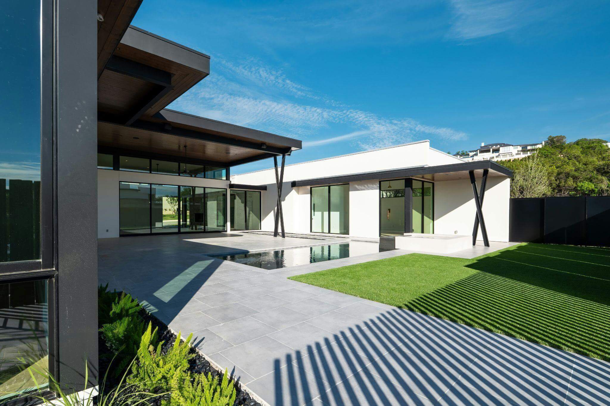 modern house with a pool in front of
