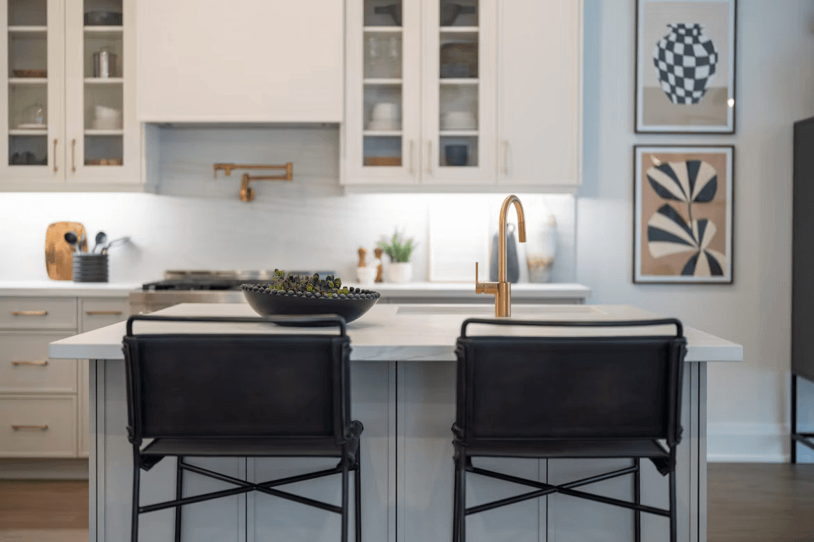 Modern kitchen island with two chairs and a bowl