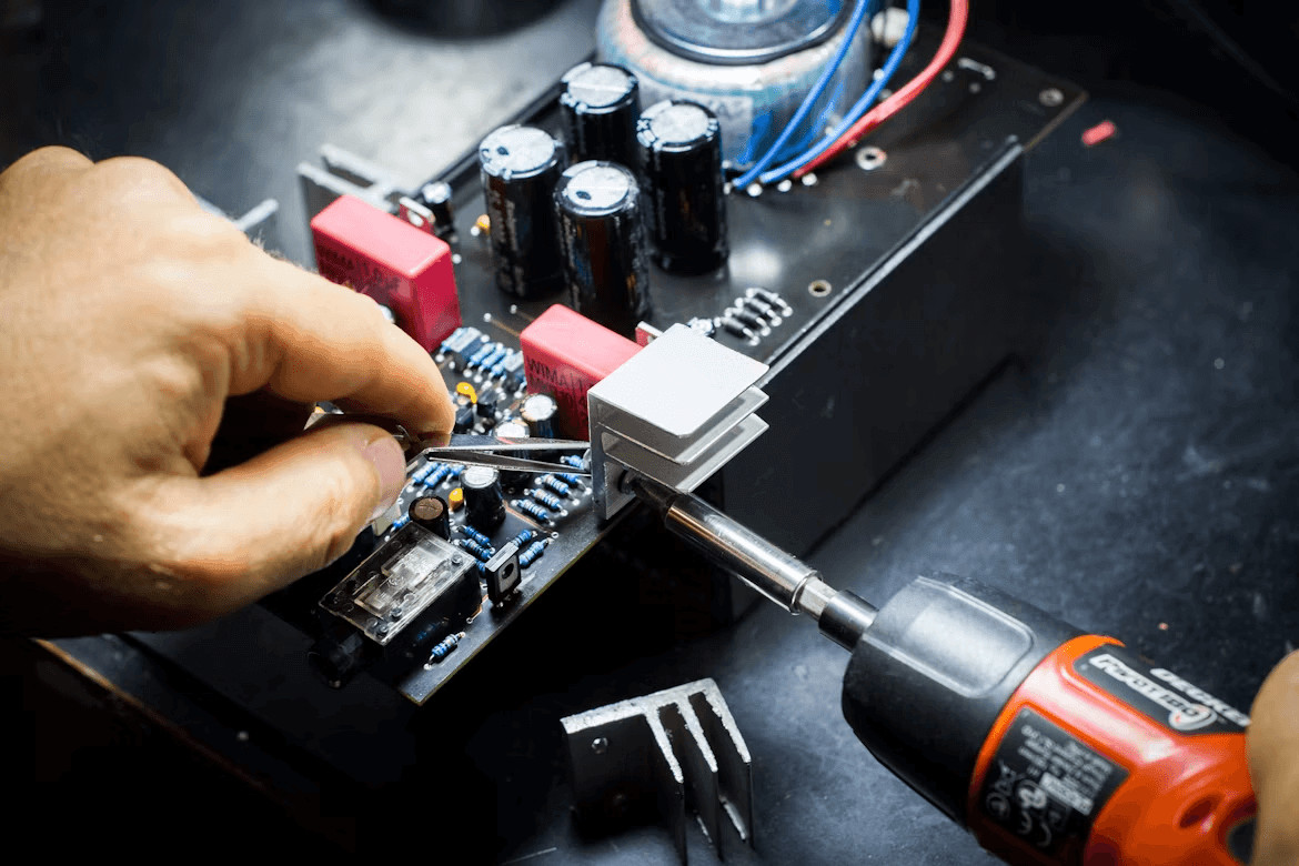 Leveling Up Your Electronics Skills as a DIY Business Owner 1 Person working on an electronics circuit board, highlighting DIY