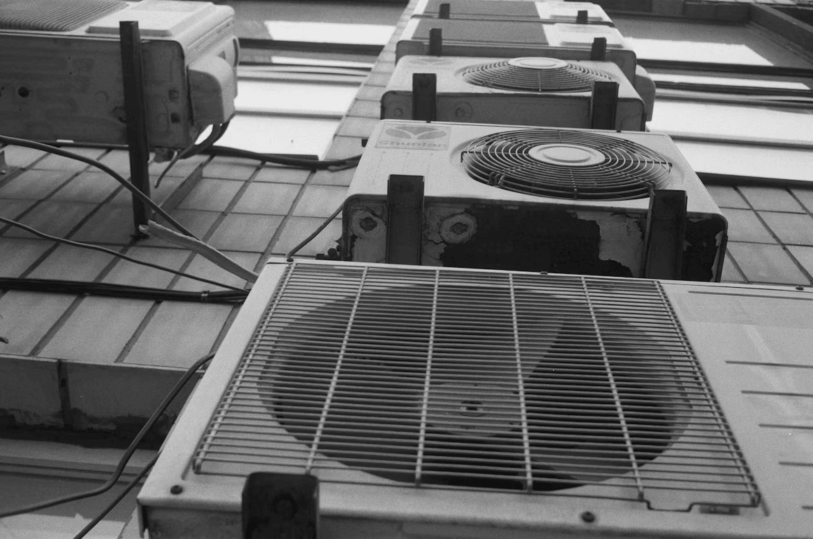 Row of air conditioning units on a tiled floor