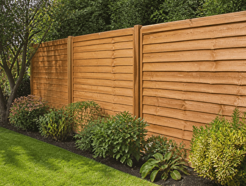 Why Upgrading Your Garden Fence Can Maximize Your Curb Appeal 3 Wooden garden fence in a lush garden