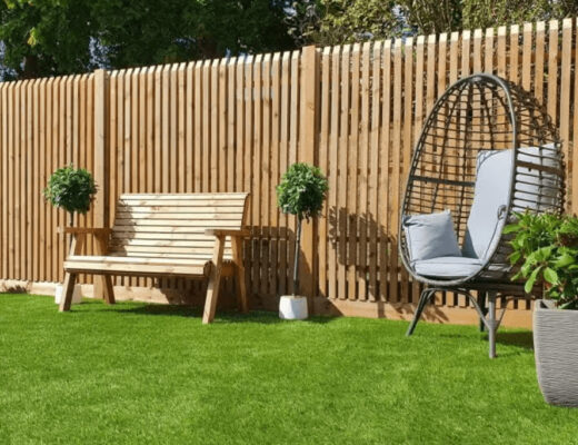 Wooden garden fence with a chair and bench
